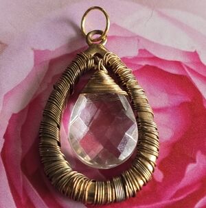 Pendant with clear briolette dark gold tone metal wire wrap wrapped